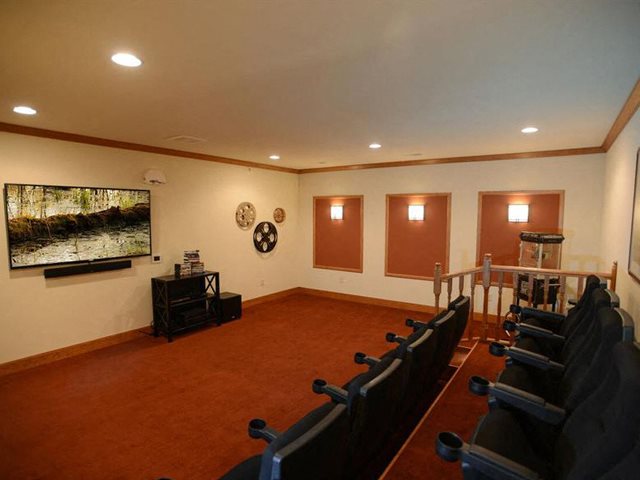 Media Room With Large Screens at Highlands at Riverwalk Apartments 55+, 10954 N Cedarburg Road