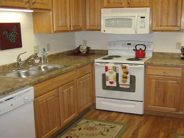 Gourmet Kitchens with Islands, Caesarstone Countertops, and Decorative Backsplash at Highlands at River Crossing Apartments, Winneconne, WI
