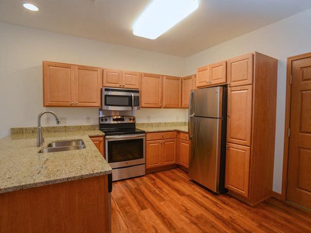 Fully equipped kitchen with Over-the-Range Microwaves at The Highlands at Mahler Park Apartments 55+, Neenah, Wisconsin, 54956