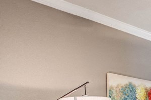 Abelia Flats - Living Room with Wood-Style Flooring and a Ceiling Fan