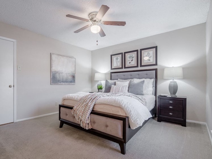 Large bedroom with ceiling fan  at Country Square, Carrollton, TX