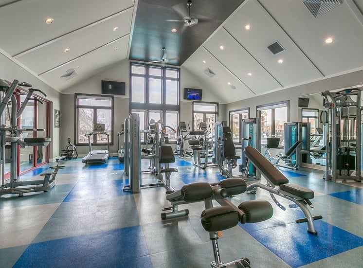 Lenexa Apartments for Rent-Waterside Residences at Quivira Apartments Spacious Gym With Updated Machines And Views Of Property