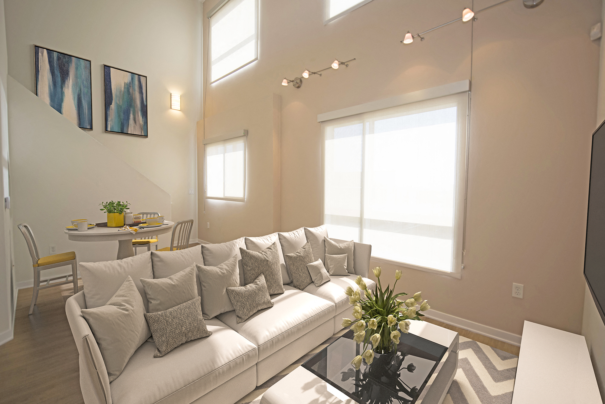 West-Los-Angeles-Apartments-NMS-1759-Beloit-loft apartment living area with white couch and sunlight daytime
