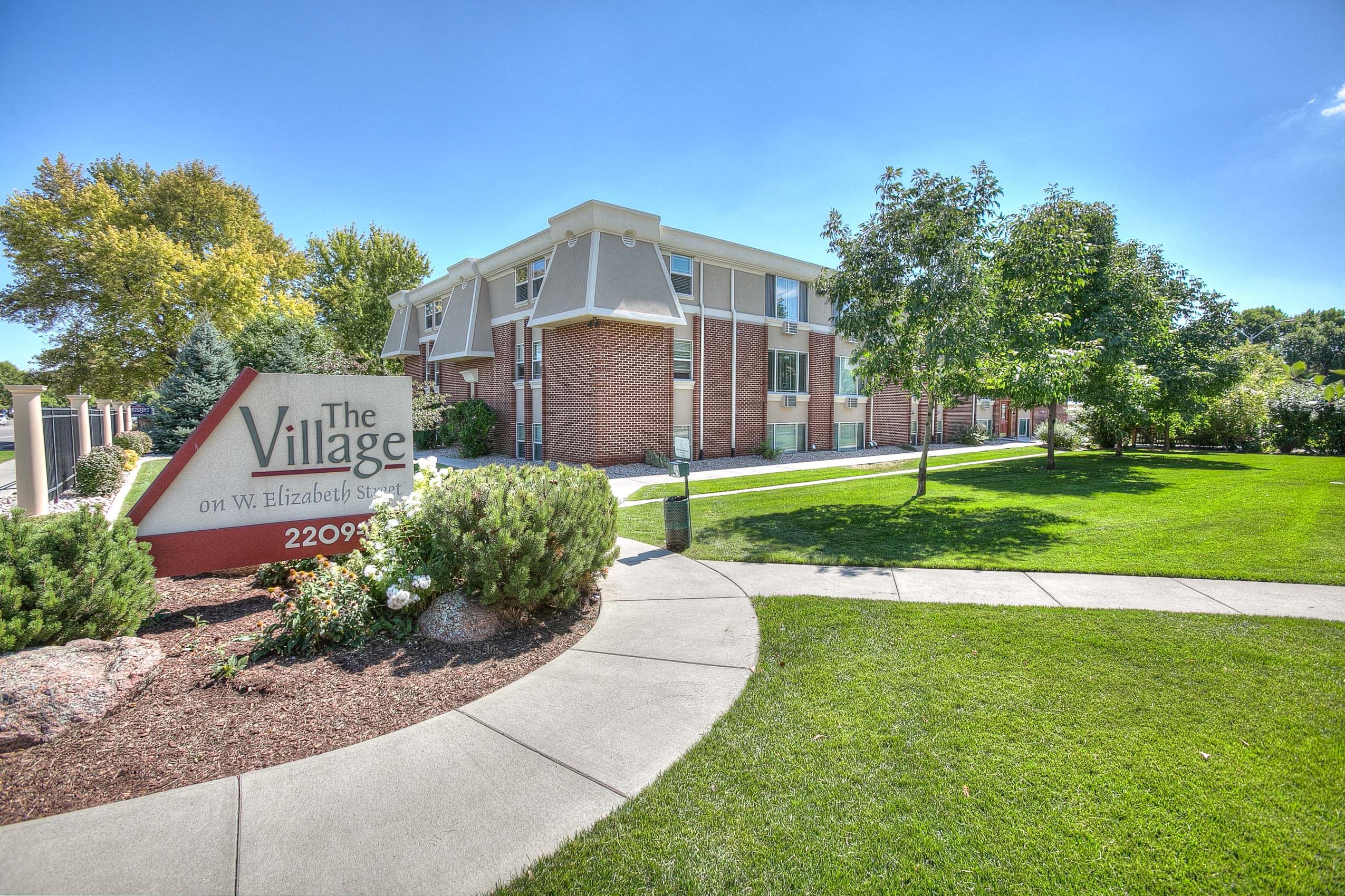 Village on Elizabeth exterior features a green area with green grass and trees