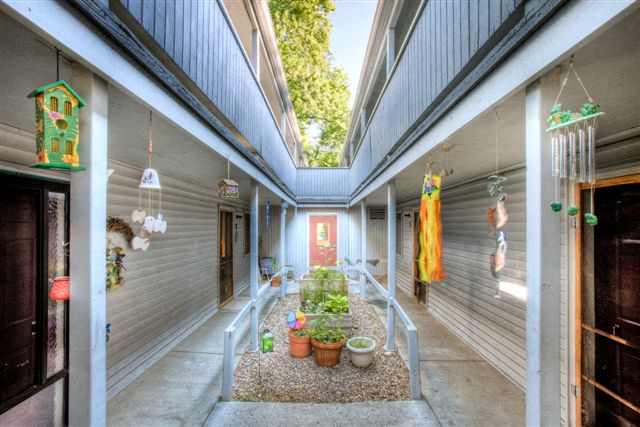 Village on Bryan interior courtyard features plants and natural light