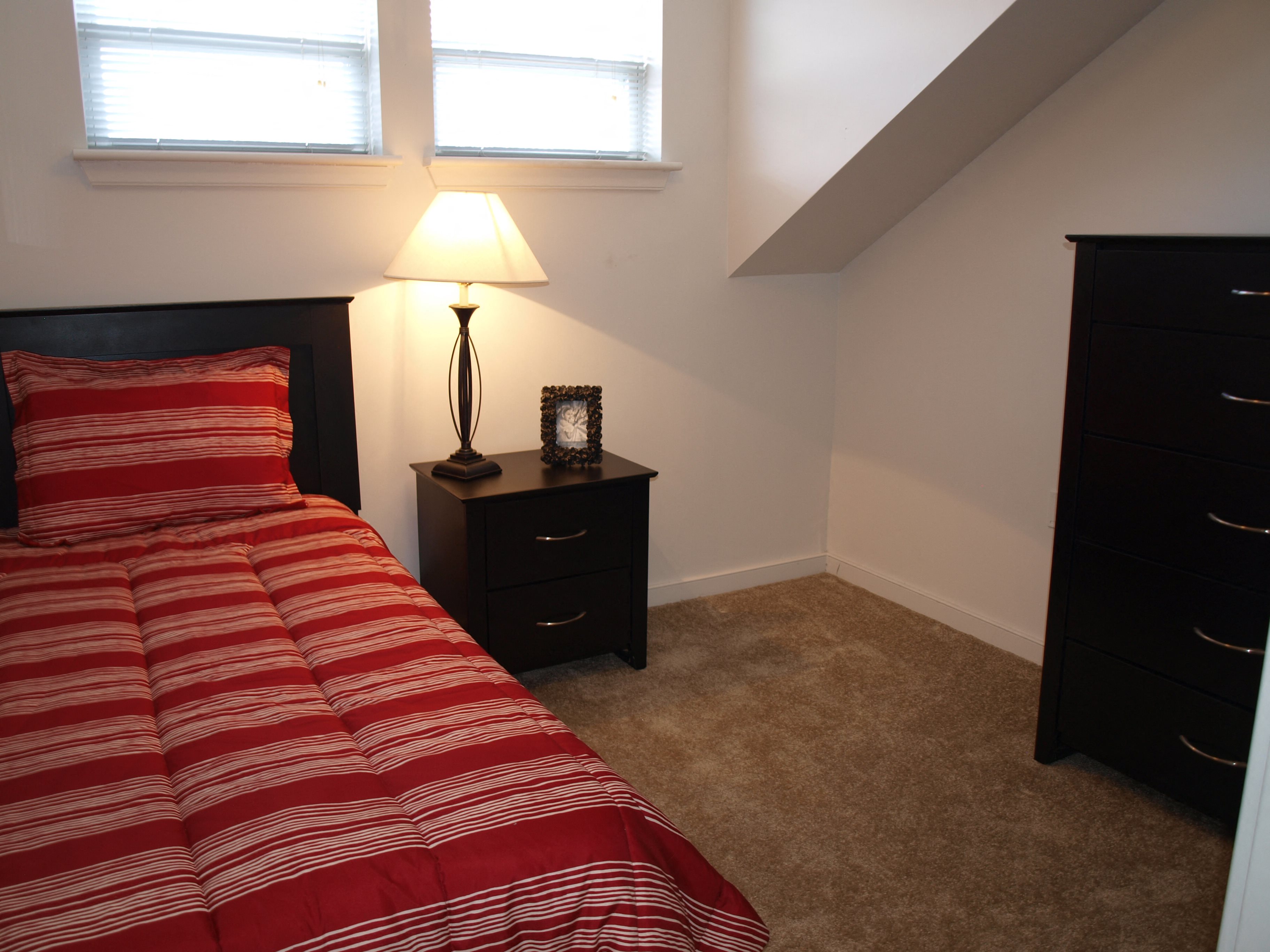 bedroom with double window in Marshall Park Townhome apartments in Richmond VA