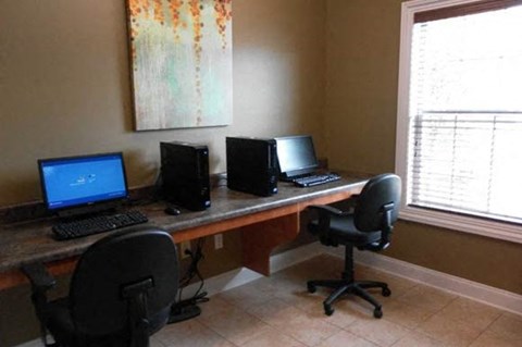 business center with computers and chairs