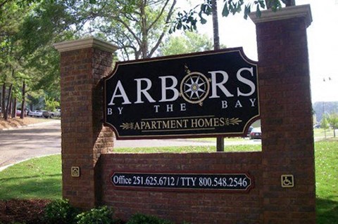 Entrance sign at Arbors By The Bay Apartment Homes Daphne AL 36526