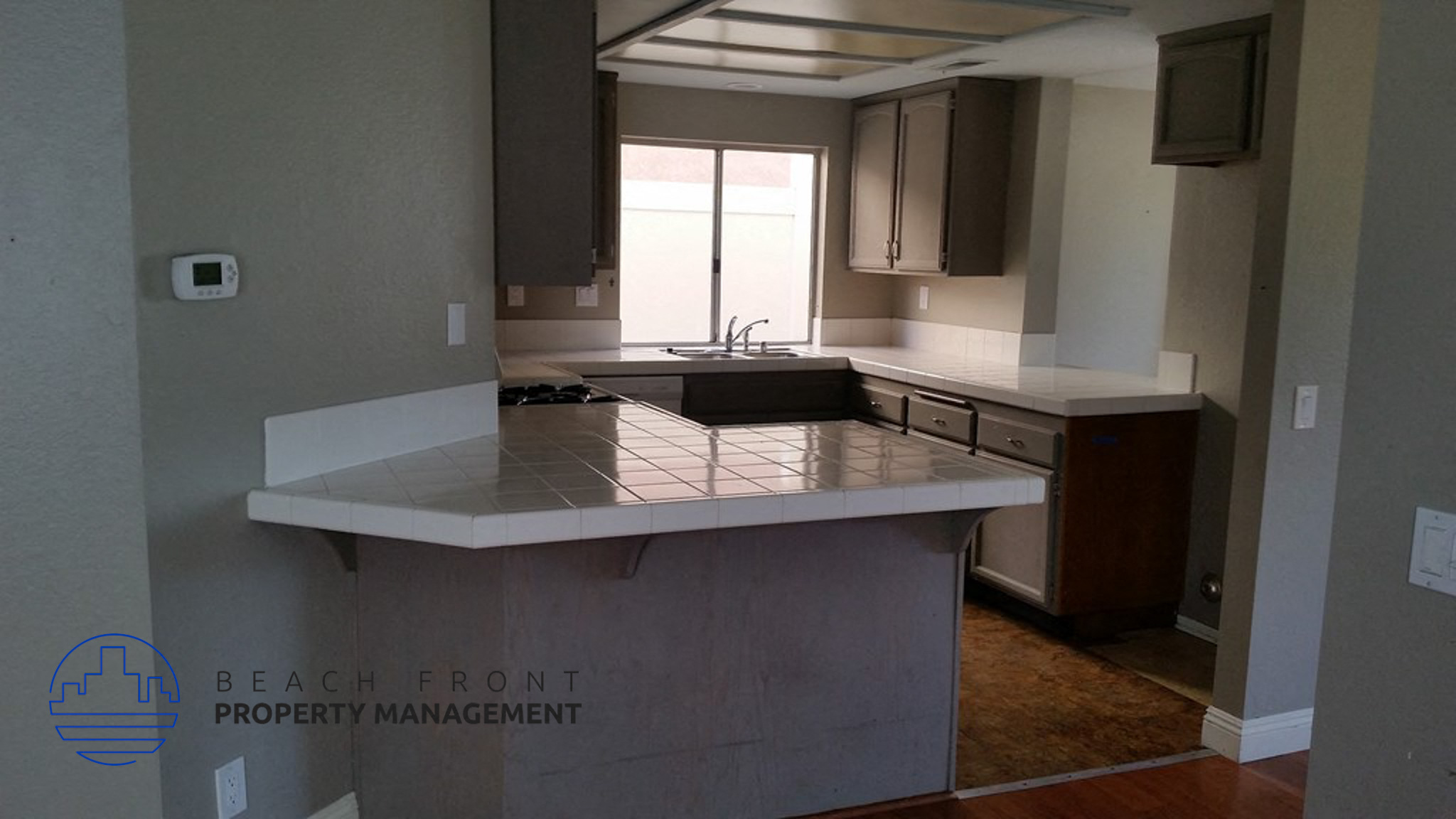 A kitchen with a countertop and a window.