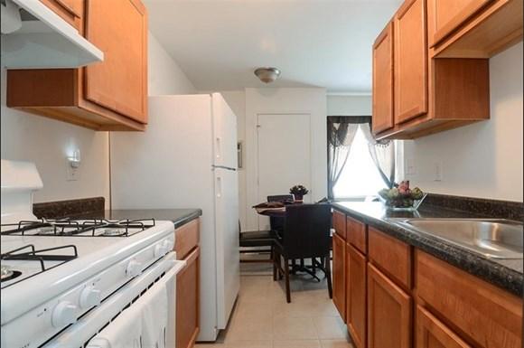 Pangea Parkwest Apartments in Indianapolis feature kitchens with appliances.