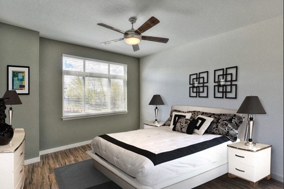 Village on Redwood interior bedroom with large window and ceiling fan