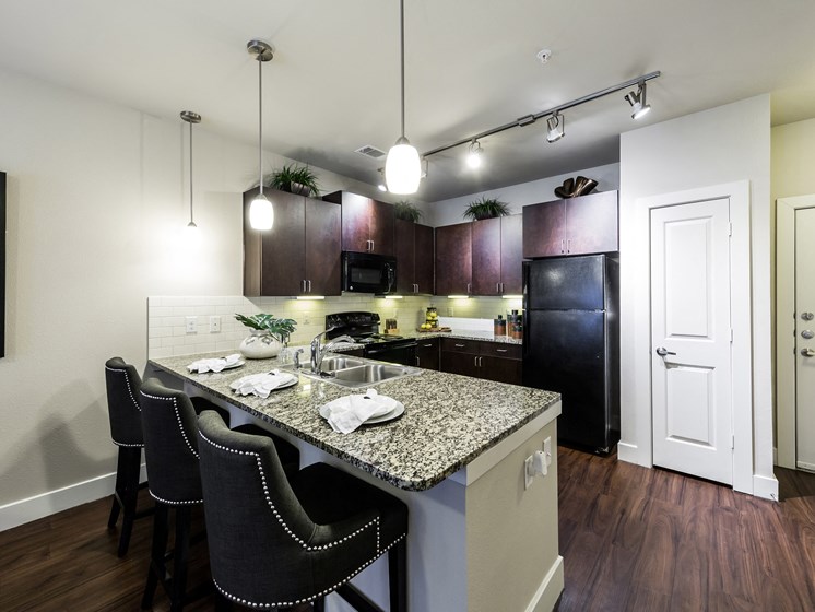 Modular Kitchen with Separate Breakfast Bar at Grand at the Dominion, San Antonio, TX 78257