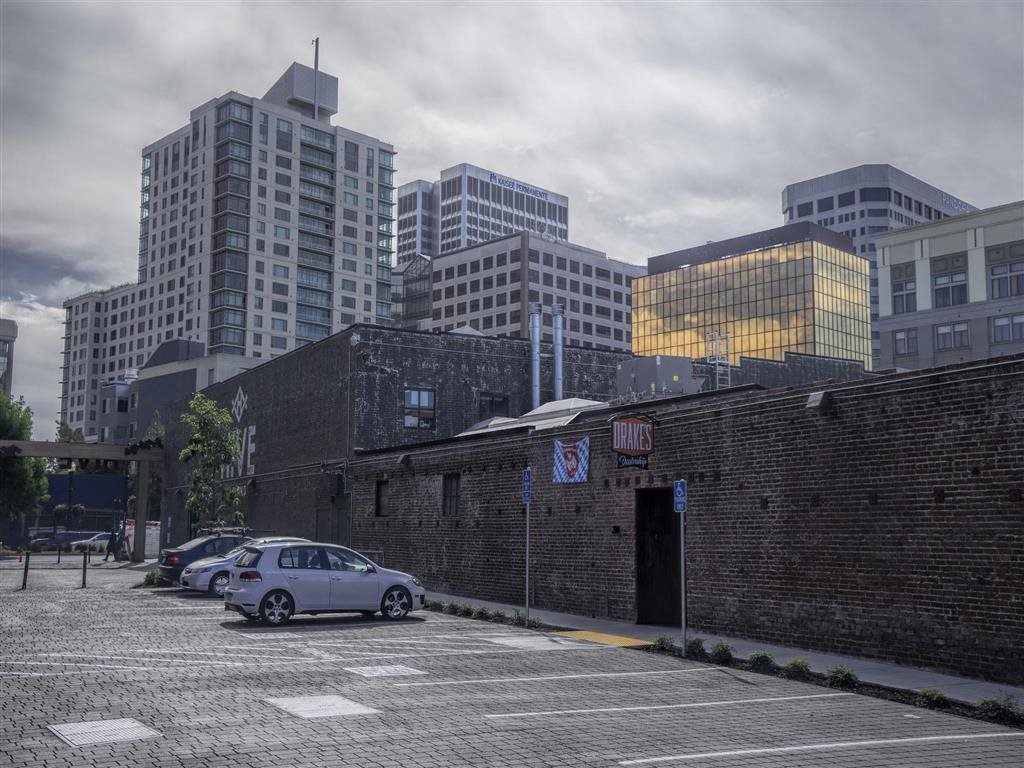 Drake's Dealership Parking Brand New Apartments for Rent | Mason at Hive Apartments in Oakland, CA Now Leasing
