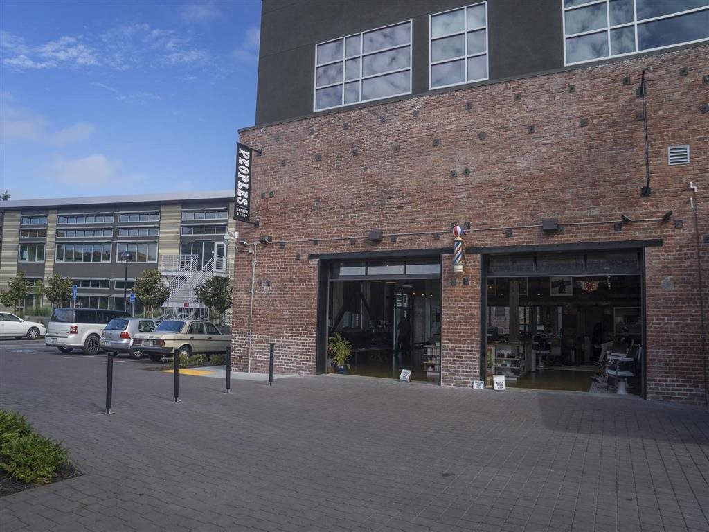 Peoples Barber & Shop Exterior Building Brand New Apartments for Rent | Mason at Hive Apartments in Oakland, CA Now Leasing