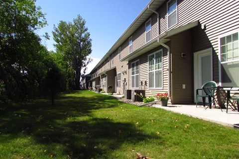 patio, backyard, matrue trees, grass, building, townhome