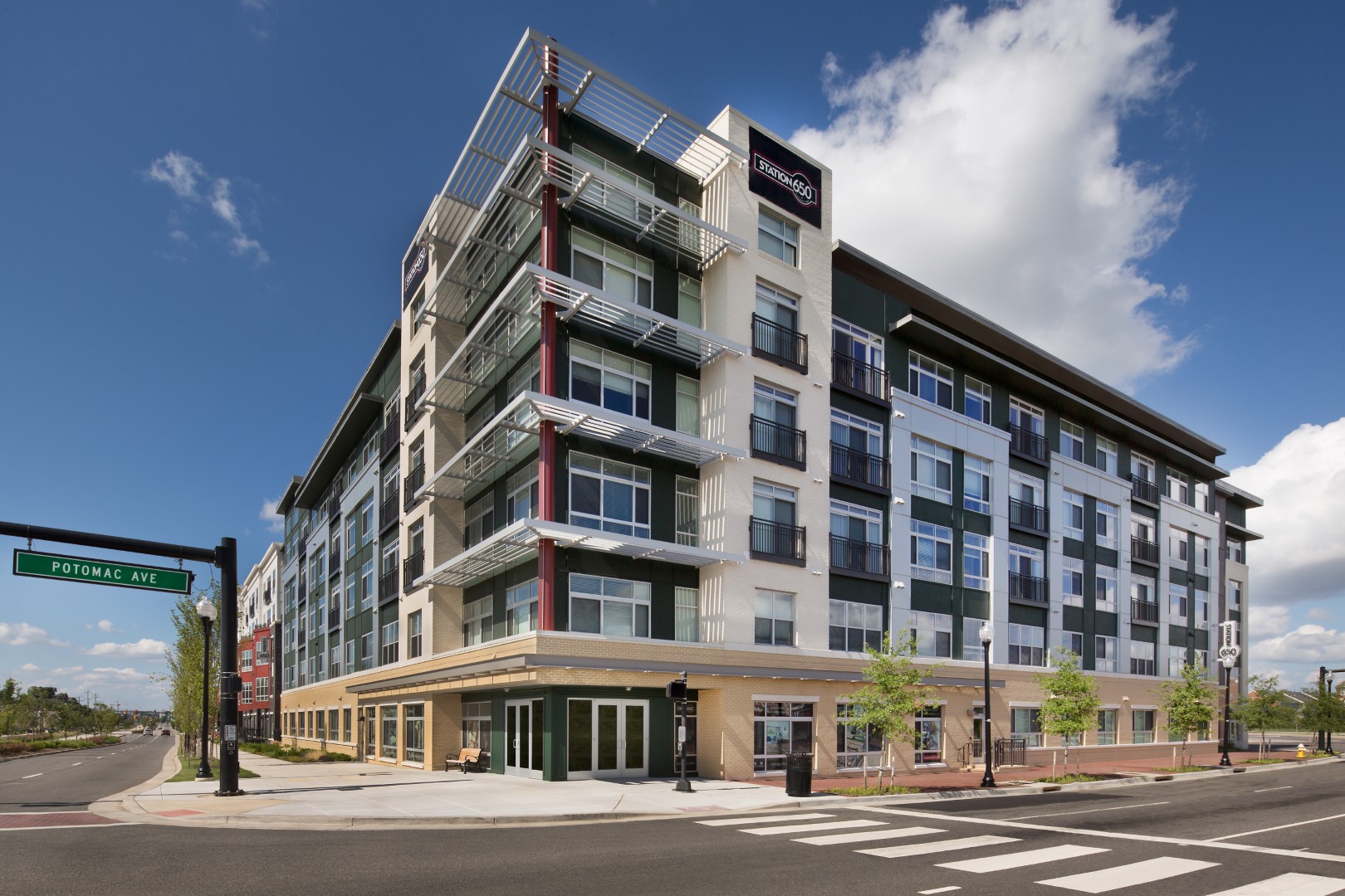 Modern mid-rise luxury apartment building exterior at Station 650 in Alexandria VA near Potomac Yard.