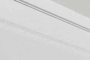 Detailed view of upscale apartment finishes, hardwood-style flooring, and contemporary interior layout