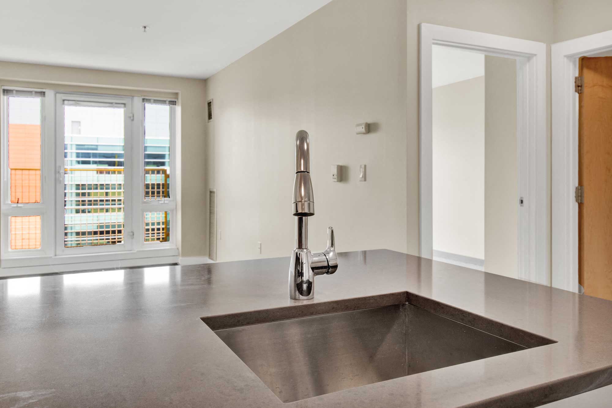 View from the sink features large windows and open space
