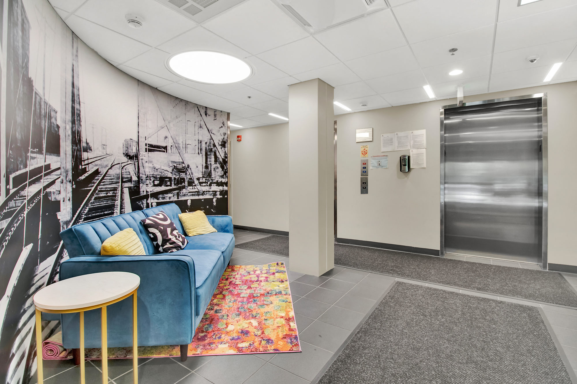 Kendall Crossing modern lobby design with photo mural