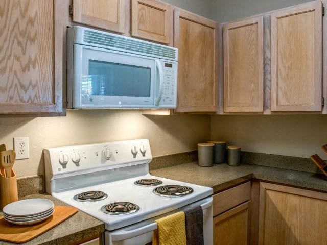 Kitchen with microwave and gas stove top