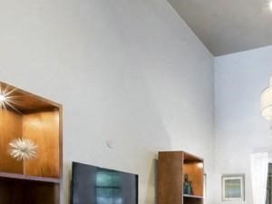 Resident lounge with couch seating and pool view
