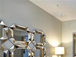 Bedroom with plush carpeting, king bed, and private bathroom