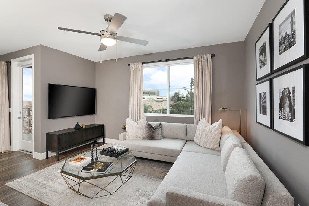 Living room with couch and television at Eleven 10 in Orange, CA