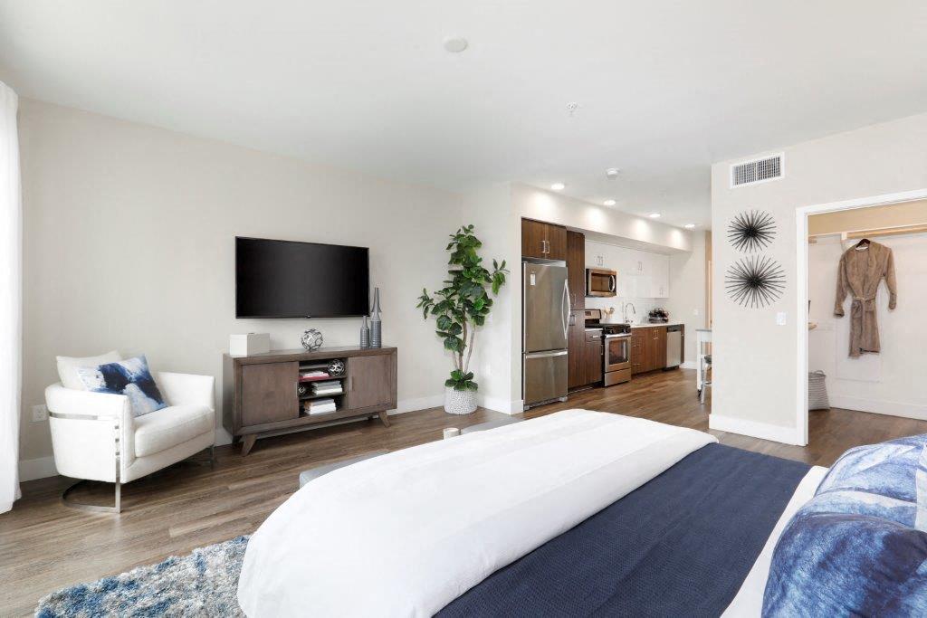 Modern bedroom with a comfortable bed and flat-screen TV