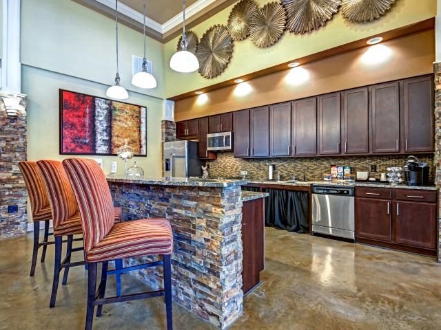 Demonstrative Kitchen with Breakfast Bar at Village at Town Center, Raleigh
