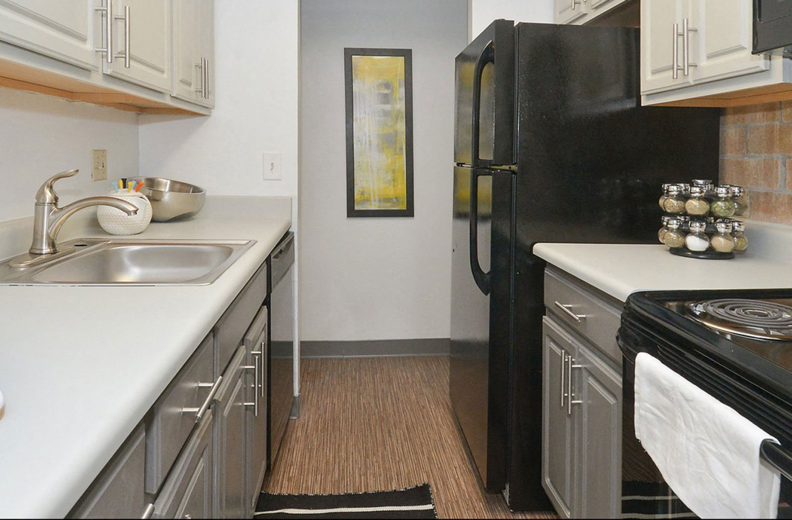 Galley-style kitchen with plenty of counter space at The Helix in Denver, CO
