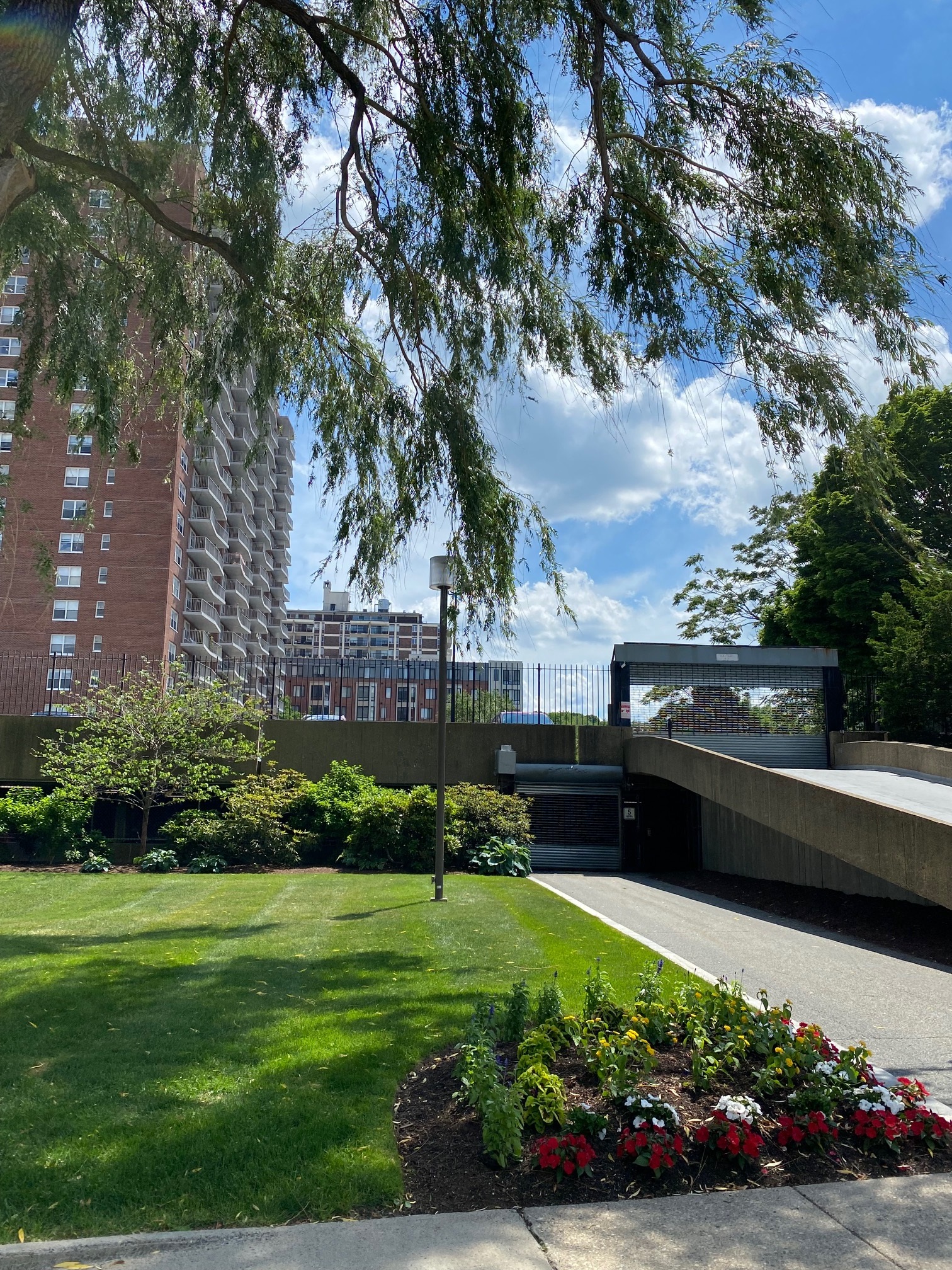 Beautiful green lawns, ramps to parking areas.