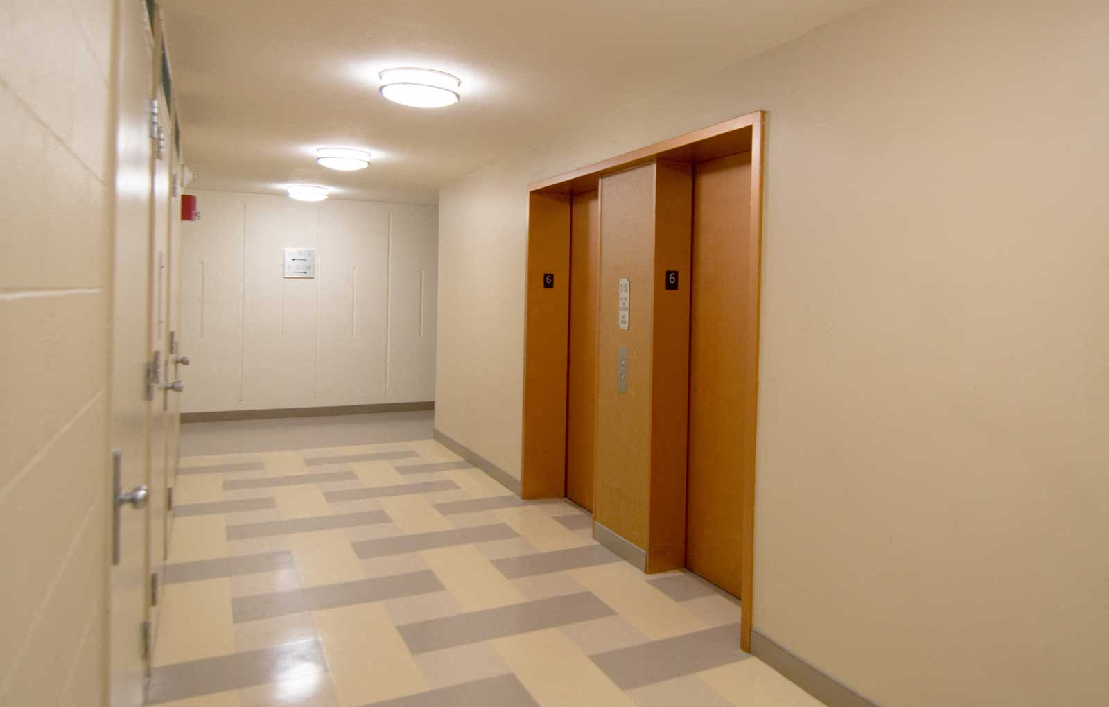 Bright, clean hallway and elevator entrance