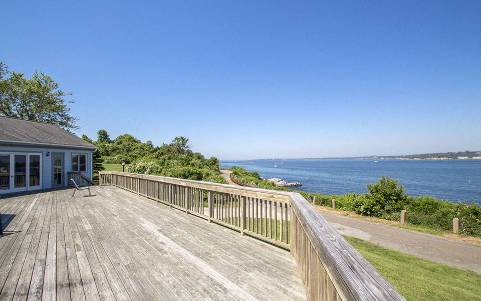 a large deck with a view of the water