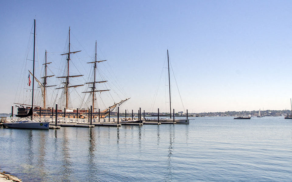 a group of sail boats docked in a harbor