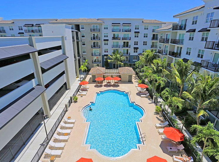 Santorini apartments in Florida features a large pool area and resident parking garage