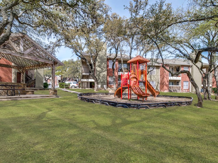 Tot Lot And Playing Field at Wildwood Apartments, CLEAR Property Management, Austin, 78752