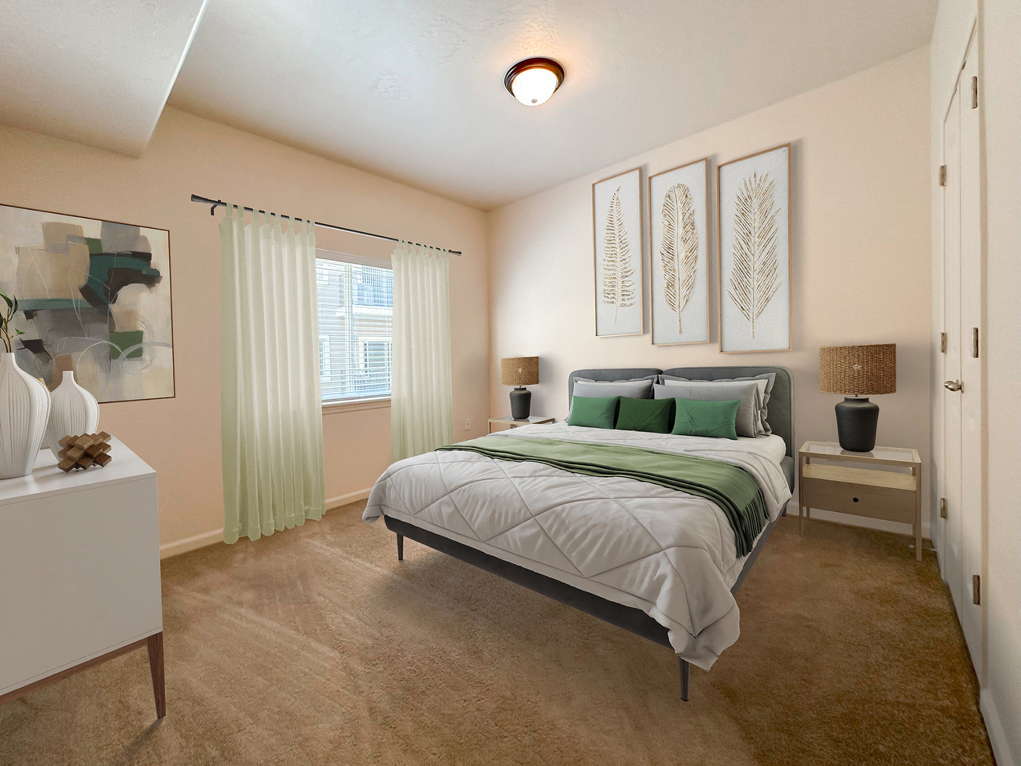 Liberty Midtown 1 Bedroom Apartment, Bedroom, bed with green accent bedding, side tables with lamps, dresser.