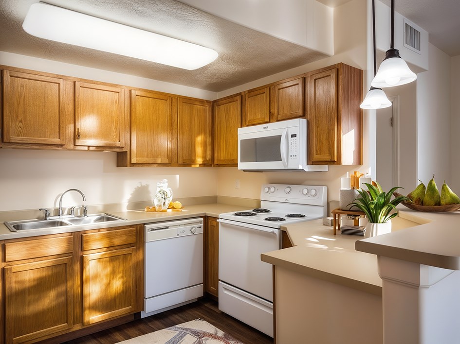 Liberty Midtown 1 Bedroom Apartment Salt Lake City, Utah, Carlyle floor plan, kitchen with angled counter, dishwasher, oven, microwave, oak cabinets