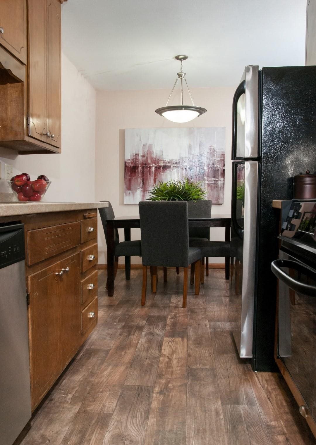 Hard Wood Floors in Kitchen Connecting to Open Dining Room at Boulevard 100 in St. Louis Park, MN