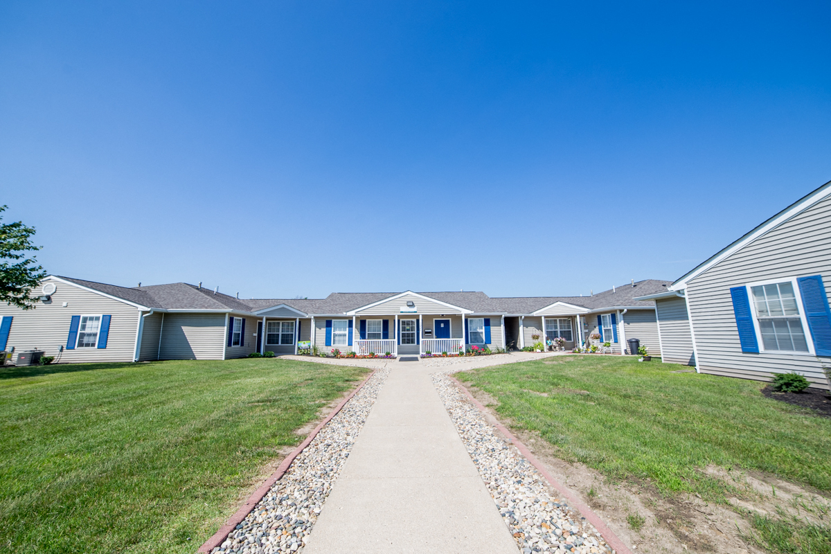 walkway in front of apartments and leasing center