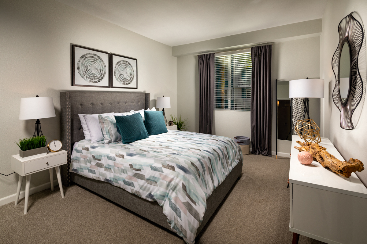 Two Bedroom Apartments in La Mesa, CA - The District Spacious Bedroom with Carpet Flooring and Large Window