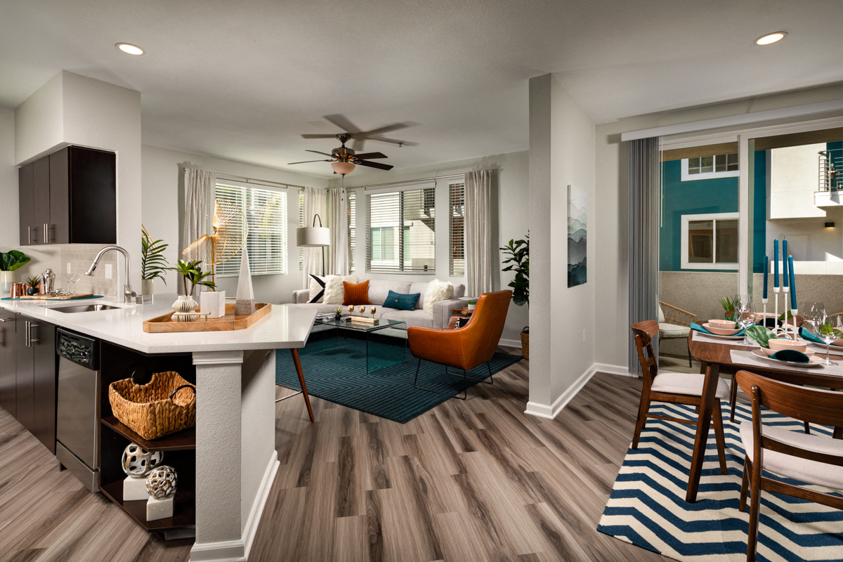 Dog-Friendly Apartments in La Mesa CA - The District - Spacious Living Room and Kitchen with Wood-Style Flooring