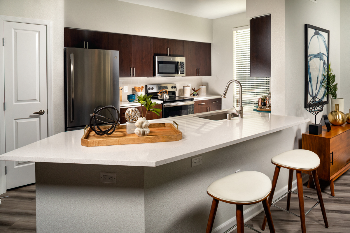 Apartments for Rent in La Mesa, CA - The District - Kitchen with Kitchen Island, Stainless-Steel Appliances, and Quartz Countertops