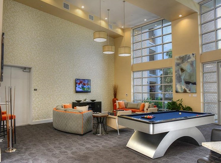 Resident lounge with wall tv, billiard and seating area