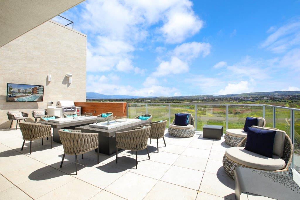 Sky deck terrace featuring tables, chairs, and panoramic views